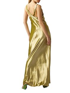 "Find CYNTHIA ROWLEY Cowl Neck Silk Lame Maxi Dress on Editorialist. Cynthia Rowley's form-fitting maxi dress is crafted of a silk blend and flaunts a cowl neck. This piece is complete with racerback-inspired shoulder straps. Cowl neck Sleeveless Racerback style 85% silk/15% metallic fibers Dry clean Made in Italy SIZE & FIT About 58\" from shoulder to hem Model measurements: 5'10\" tall Model is wearing US size Small. Cynthia Rowley. Color: Green. Size: XS." Fitted Bias-cut Maxi Dress, Fitted Long Slip Dress With Bias Cut, Floor-length Slip Dress For Night Out, Floor-length Bias Cut Maxi Dress For Party, Party Maxi Dress With Bias Cut, Bias Cut Floor-length Maxi Dress For Party, Party Bias Cut Maxi Dress, Fitted Maxi Length Cocktail Slip Dress, Chic Floor-length Bias Cut Maxi Dress