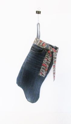 a pair of jeans hanging from a hook