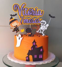 there is a cake that has been decorated with children's halloween decorations on it