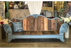 a bench made out of wooden planks and painted with chalk paint in a store