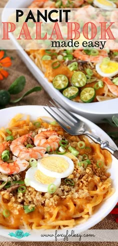 two plates filled with pasta and shrimp next to an egg in the middle on a table