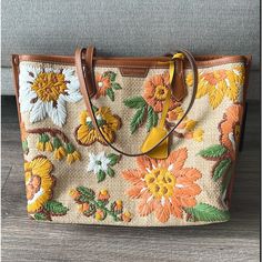 New With Tags, With Original Package. Get Vacay-Ready Style With This Woven Straw Tote Featuring Colorful Embroidered Flowers And A Roomy Interior. Size: 13.55" L X 11.16" H X 5.34" D Top Zip Closure Dual Shoulder Straps Exterior Features Woven Straw With Floral Embroidery And Leather Trim Lined Interior Textile And Leather Exterior/Cotton Lining Mannequin's Height For Scale: 5'9" Designer Embroidered Bags For Daily Use, Designer Embroidered Shopping Bag, Designer Embroidered Bags For Shopping, Designer Embroidered Shoulder Bag For Travel, Embroidered Shoulder Bag For Shopping, Designer Embroidered Tote Bag, Brown Rectangular Bag With Embroidered Logo, Brown Bags With Embroidered Logo For Shopping, Embroidered Beige Leather Bag