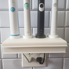 "Custom 3D printed electric toothbrush holder with slots for 4 Philips sonicare chargers.  Organize and hide your charger cords and free up valuable space.  Declutter your bathroom counter while still charging your toothbrushes.  This toothbrush holder is mounted by replacing your existing outlet plate with a custom design and printed plate that is provided with your purchase.  This innovation looks sleek, clean and modern! Color:  White Product Dimensions: 6.5\" x 4\" x 8.75\" Base:  Philips So Retainer Cleaner, Philips Sonicare Toothbrush, Plate Chargers, Sonicare Toothbrush, Electric Toothbrush Holder, Toothbrush Holders, Outlet Plates, Philips Sonicare, Bathroom Counters