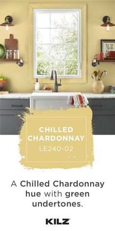 a kitchen with yellow walls and gray cabinets, the words chilled chardonnay written in white