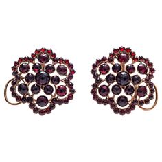 it is very rare indeed to find earrings from the Rokoko period. This pair of garnet rosettes has kept it's period fitting and is in wonderful condition considering it's age. Garnet Earrings, Very Rare, 18th Century, Garnet, Jewelry Earrings, For Sale