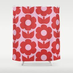 a red and white shower curtain with flowers on it