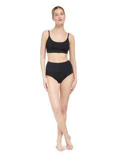 This playful and flattering bikini top is a fun take on a sporty crop-top and can be worn with any of our classic midrise or high rise bottoms. The beautiful scoop neckline is balanced by a beautiful dip at the back bodice, and you will feel supported by the secure under bust band.  This style is cut from a textured and recycled fabric that offers SPF50+ protection. Take Erika beyond the beach paired with the Rachel Skirt, or our favorite Brooke beach pant for chic getaway style.  Color: Auburn Cropped Stretch Swimwear With Built-in Bra, Poolside Crop Top With Built-in Bra, Full Coverage Sports Bra, Summer Fitted Scoop Neck Bra, Fitted Seamless Cropped Bra, Seamless Cropped Fitted Bra, Scoop Neck Sports Bra With Removable Pads For Summer, Summer Sports Bra With Medium Support And Scoop Neck, Cropped Bra With Medium Bust Support