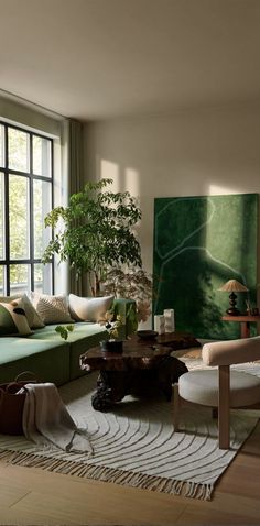 a living room filled with lots of furniture and a large painting hanging on the wall