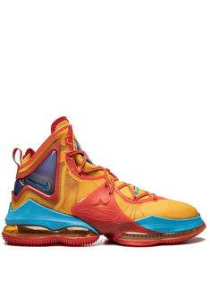 the nike lebrone basketball shoe is shown in yellow, blue and red colors