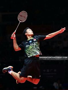 a man jumping in the air with a tennis racket