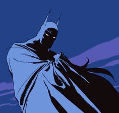 a batman standing in the dark with his cape draped over his head and eyes closed