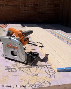 a cordless jig saw is laying on the ground