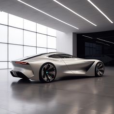 a futuristic car is parked in an empty garage