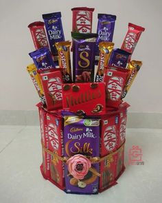 an assortment of chocolates and candy bars in a gift box