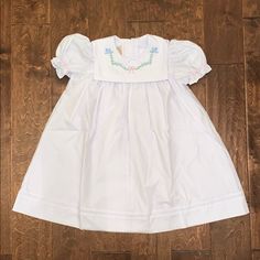 Short Sleeve Pearl Pintuck Dress - Worth Avenue White With Bluebird And Bow Embroidery - 6 Price Firm Lined Cute White Smocked Dress With Short Sleeves, Cute White Smocked Dress For Baptism, Cute White Smock Dresses, Pintuck Dress, Bow Embroidery, Beaufort Bonnet Company, Beaufort Bonnet, Red Velvet Dress, Crochet Halter Tops