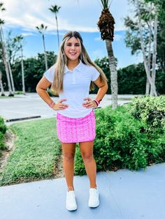 The Marlee Skort is a classic style mixed with everyday fun. This golf and tennis skort will take the win in your next game. The effortless elastic pull-on color block waistband adds style and function. All great golf skorts and tennis skorts need pockets, and this one has plenty. Coordinating attached mesh shorts with side pockets are perfect for windy days & cartwheels. Our stretch-woven fabric was designed for comfort and movement, complete with 40+UPF sun protection and moisture wicking prop White Athleisure Tennis Skirt For Cheerleading, Sporty Tennis Skirt For Pickleball In Summer, Sporty Pink Tennis Skirt, Casual Pink Tennis Skirt For Sports, Sporty Pink Tennis Bottoms, Sporty Skort For Pickleball In Spring, Summer Athleisure Bottoms For Pickleball, Pink Sporty Tennis Skort, Sporty Pink Tennis Skort