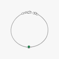 Our simple and elegant solitaire bracelet features a round cut natural emerald at its center. We can craft this bracelet in 14K or 18K Gold according to your preference.★ Bracelet Features• Gold Kt: 14K/18K Solid Gold (All pieces are stamped for authenticity)• Available Gold Colors: Yellow Gold, Rose Gold, White Gold• Center Round Cut Emerald Weight: 0.12 carat• We only work with real natural emeralds• We offer a signed certificate with each bracelet for the authenticity of the center emerald stone.• Center Diameter: 4.6 mm Round White Gold Bracelets With Emeralds, White Gold Emerald Bracelets, Classic Bracelets With May Birthstone, White Gold Emerald Bracelet, Classic May Birthstone Bracelets, Dainty May Birthstone Bracelets, Dainty May Birthstone Bracelet, Classic White Gold Bracelets With Birthstone, Formal Round Bracelet With May Birthstone