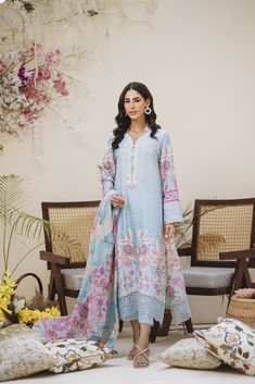 An Uber cool Ice blue ombré in-house printed raw silk shirt and dupatta. All feminine details of Pearls all over the shirt with hand-worked buttons. Our signature sleeve hem style is finished with pearl tassels and our in-house embroidered fabric. The daman is beautifully done with our appliquéd in-house embroidery. Printed dupatta in cool refined colors is finished off with laces and plain pants. Pearl Tassels, Plain Pants, Textile Printing, Crane Bird, Embroidered Fabric, Silk Dupatta, Hem Style, Fashion Consultant, Blue Ombre