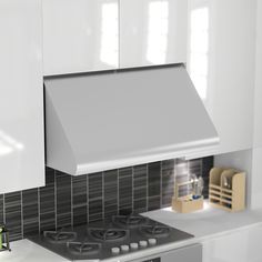 a stove top oven sitting inside of a kitchen next to white cabinets and counter tops