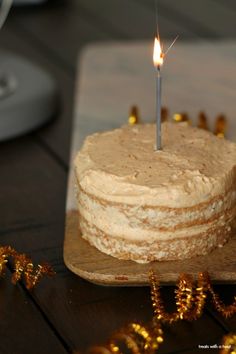 a birthday cake with a single candle on it