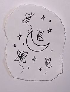 a piece of paper that has some drawings on it with stars and moon in the background