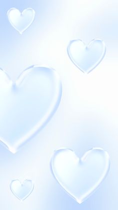 three white hearts floating in the air on a blue and white background with some bubbles