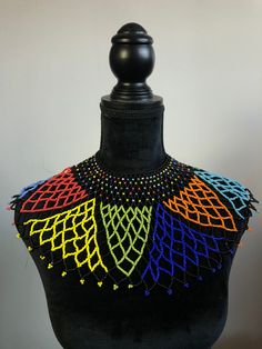 Triangles are larger than the others. Any questions, feel free to reach out. Thank you. Festival Multicolor Beaded Bib Necklace, Multicolor Beaded Choker With Black Beads, Multicolor Choker Necklace With Black Beads, Multicolor Beaded Necklaces With Black Beads For Party, Multicolor Beaded Necklace With Black Beads For Party, Multicolor Black Beaded Necklaces For Party, Black Beaded Bib Necklace, Faceted Beads Beaded Necklaces For Festival, Multicolor Beaded Necklace With Black Beads