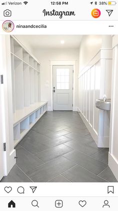 an empty hallway with white cabinets and gray flooring is shown on the instagram page