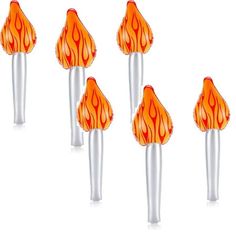 four orange and silver candles with flames on them are lined up in a row against a white background