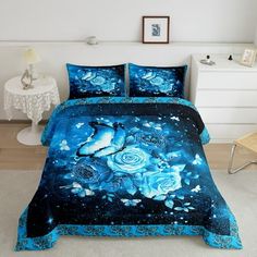 a bed with blue flowers and stars on it