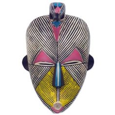 an african mask is shown against a white background