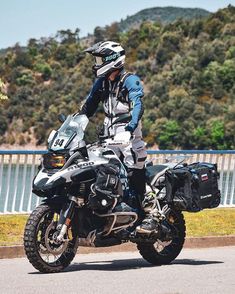 a man riding on the back of a motorcycle