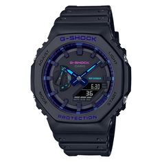 The classic Casio G-Shock analog-digital watch takes a dive into the world of virtual reality with this Virtual World style. The basic black coloring of the watch is accented by blue violet, which creates a futuristic atmosphere of virtual reality that pairs well with this model's octagonal bezel. Case/bezel material: Carbon/Resin Black Resin Band Mineral Glass Shock Resistant Carbon Core Guard structure 200-meter water resistance Double LED light LED light for the face (Super illuminator, selec G Shock Ga 2100, G Shock Men, G Shock Black, Elapsed Time, Series Black, Mens Watches Black, G Shock Watches, Countdown Timer, Casio G Shock