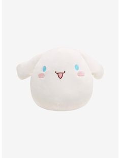 a white stuffed animal with blue eyes and pink cheeks, sitting in front of a white background