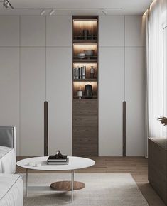 a living room filled with furniture and white walls