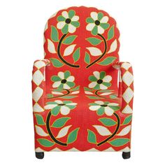 a red chair with green and white flowers on the back, sitting in front of a white background