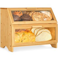 a wooden display case filled with bread and pastries