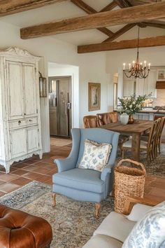 a living room filled with furniture and a wooden table