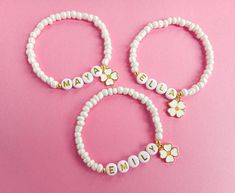 If you are looking for great quality and affordable 'Will you be my Flower Girl' proposal gifts, our personalized name beaded bracelets with flower charms, proposal cards and sweet gift boxes is the perfect choice! Make your little bridesmaids feel like princesses in your wedding day with these personalized bracelets without breaking the bank!  ♥ This dainty bracelet is perfect gift for your flower girls, jr bridesmaids or bridesmaids ! MATERIALS: ♥ 4 mm pearlised glass seed beads ♥ 6 mm gold letter beads ♥ round 14K gold pleated accent beads and flower charm. ♥  Our bracelet is packed in a gift box wrapped in organza ribbon and a special proposal card , ready to gift ! (if you choose box option).  "Bracelet Only" will not come with box. 🎁If you choose 'Bracelet Only ' option; your unboxe Custom Name Beaded Bracelet For Valentine's Day, Custom Name Beaded Bracelets For Valentine's Day, Personalized Flower Jewelry For Friendship, Personalized Flower-shaped Jewelry For Friendship, Personalized Flower Shaped Friendship Jewelry, Personalized Flower-shaped Friendship Jewelry, Customized White Jewelry For Birthday Gift, Personalized White Charm Bracelet For Birthday, Customizable White Charm Bracelet For Birthday