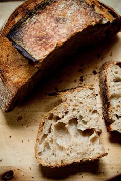 several pieces of bread sitting on top of a cutting board