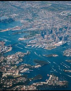 an aerial view of the city and water