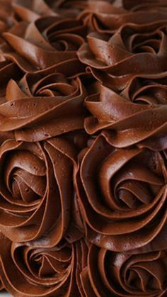 a close up of a cake with chocolate frosting