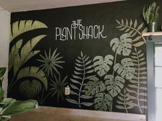 a chalkboard with plants painted on it and the words plant shack written in white