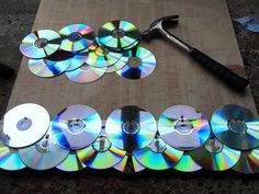 there are many cd's on the table with tools