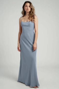 a woman in a long blue dress