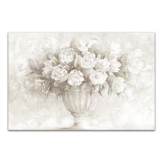 a vase filled with white flowers on top of a table