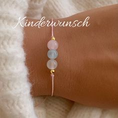 As a gift for your loved ones or for yourself, you will feel supported, protected and safe <3 The bracelet is made of macrame yarn with rose quartz, aquamarine and moonstone natural stone beads (6 mm). The spacer beads (3 mm) are made of 14k gold filled or stainless steel It is adjusted with a knotted sliding clasp so that it fits almost every wrist. Your piece of jewelry will be delivered ready for gifting with a beautiful card with meanings and motivational quote and in a delicate organza bag <3 Aquamarine: calming, hormonal balance Rose Quartz: Promotes love in relationships, harmony Moonstone: promotes fertility, positive effect on conception Yarn material: waxed polyester Material beads: natural stone Material spacer beads: 14k gold filled or stainless steel 🤍 When you buy 3 items yo Lucky Charm Gifts, Macrame Yarn, Quartz Rose, Charm Gift, Rock Crystal, Crystal Pearls, Motivational Quote, Lucky Charm, Organza Bags