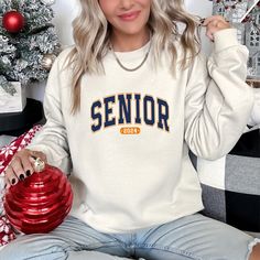 Senior 2024 Graduation Sweatshirt, Class Of 2024, Senior 2024 Sweatshirt, College Senior, Gift for Senior, Graduation Gift,Gift For Graduate 🌾Welcome to "Boutique Grace Sweatshirt & Hoodie store"... I will be presenting sweatshirts and hoodies, which are indispensable for your autumn and winter days, with special and different designs in my store.🌾 🌾Product Features ✔️Gildan® Heavy Blend™ Unisex Sweatshirt  ✔️50% Cotton / 50% Polyester ✔️Preshrunk fleece knit ✔️Classic Fit ✔️ Air jet yarns = Varsity Crew Neck Tops For College Events, White Collegiate T-shirt For Winter, White Varsity T-shirt For Winter, White Varsity Top For College Events, White Tops For School And Sports Season, White Tops For School Sports Season, White School Spirit T-shirt For Winter, White Winter Tops For Campus, Crew Neck Tops For School Sports Season