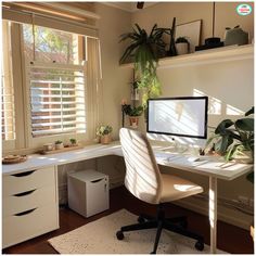 a desk with a computer on top of it next to a window filled with potted plants