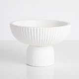 a white bowl sitting on top of a table